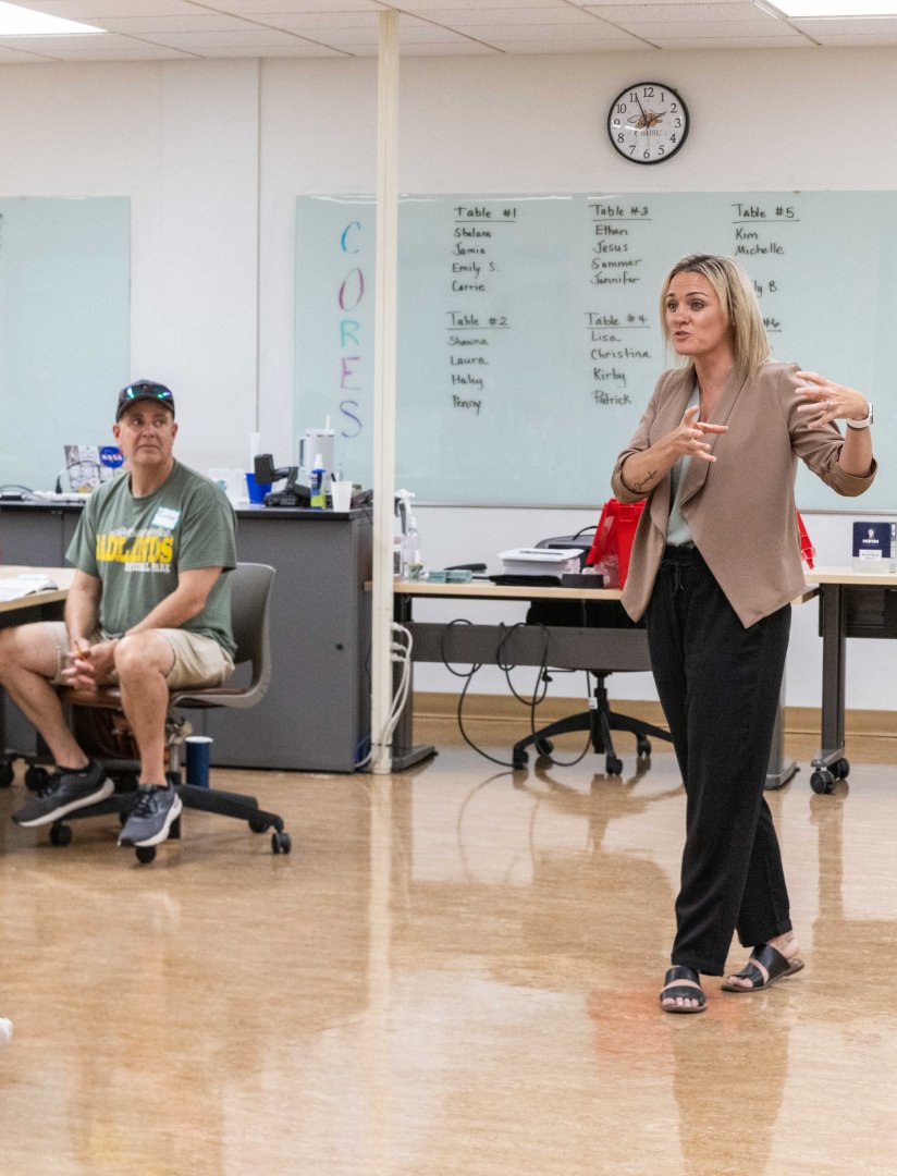 Teacher talking to a group of people